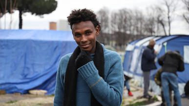 A young migrant in a makeshift settlement in Italy.