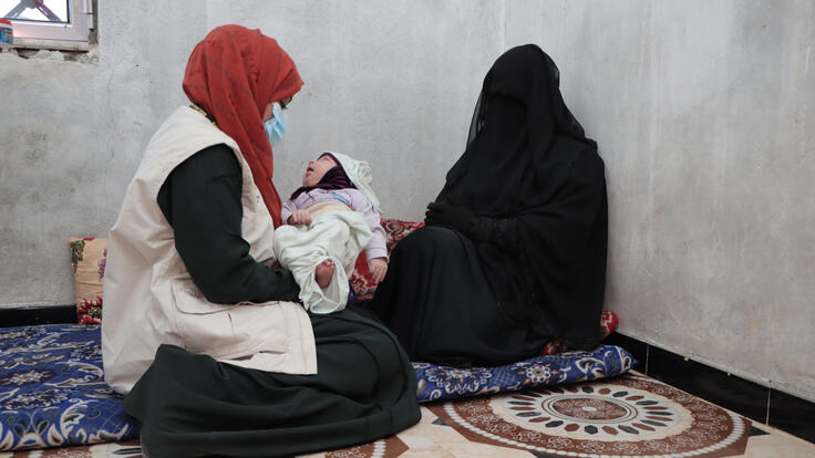 Dr. Bushra with one of her clients during a field visit to her home