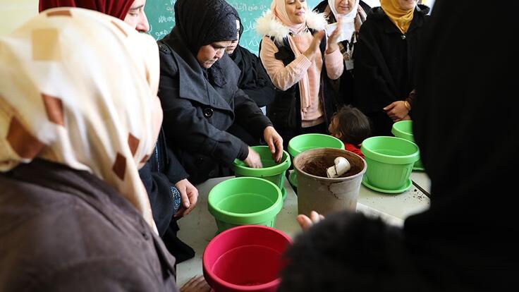 This group of women are participating in an activity called ‘Planting Seeds of Hope’in North Lebanon. This activity aims to empower women to build new skills for their futures.