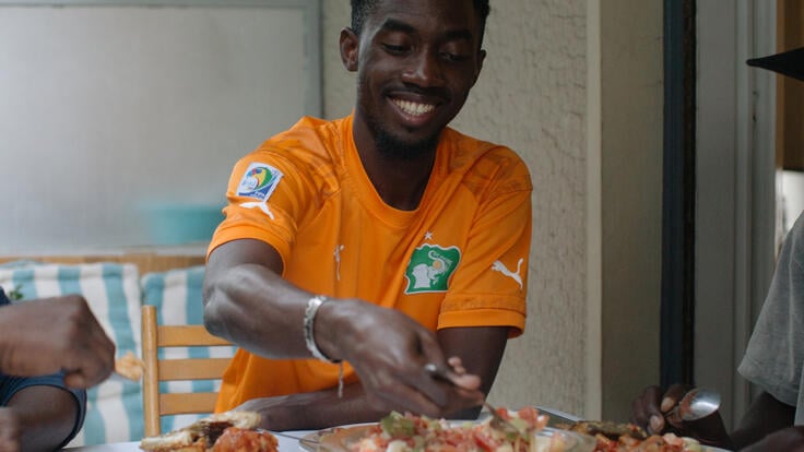 Moussa prepares a traditional Ivorian meal.