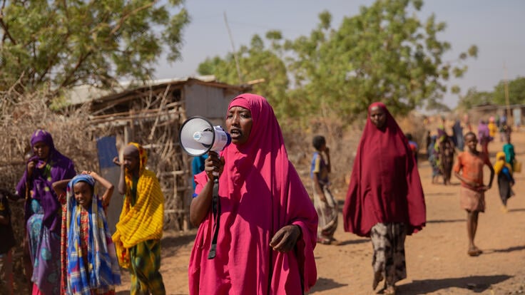 Somali refugee Zainab holds megaphone to raise awareness of women's rights