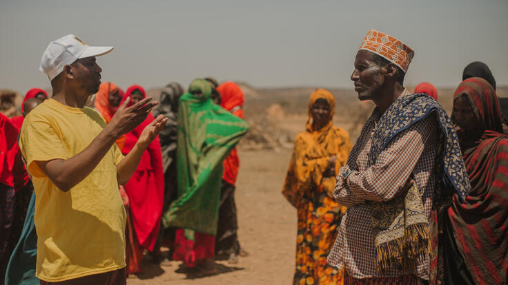 Niman Arab, Emergency Rapid Response Manager, talks with other residents in Somali region, Ethiopia.