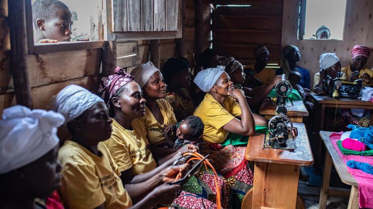 Congolese women knit together.