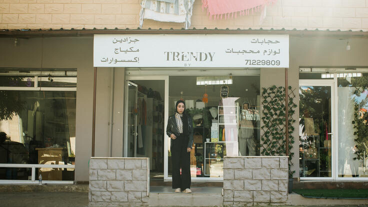 Nour stands outside her store in Chehime, Lebanon.