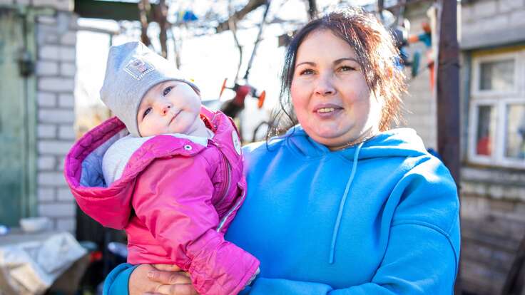 Olena holding her baby