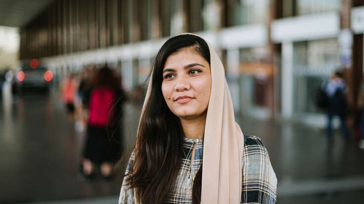 Maryam faces the camera, smiling.