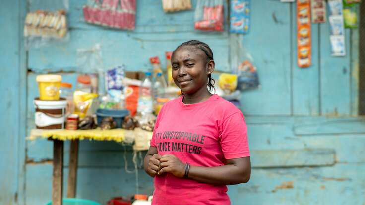 A woman wearing a pink T-shirt