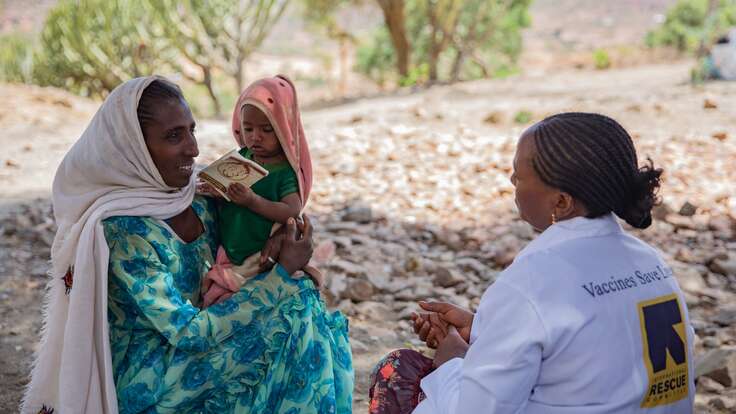 An IRC health worker prepares to administer a vaccine to a young child in Tigray, Ethiopia.