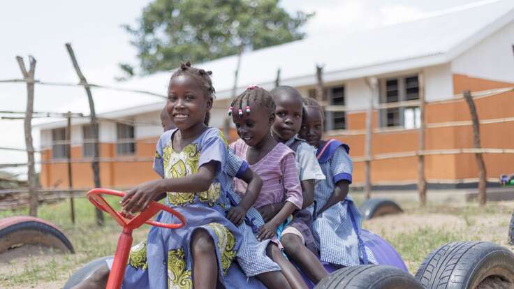 Five children play at a playground in Ethiopia.