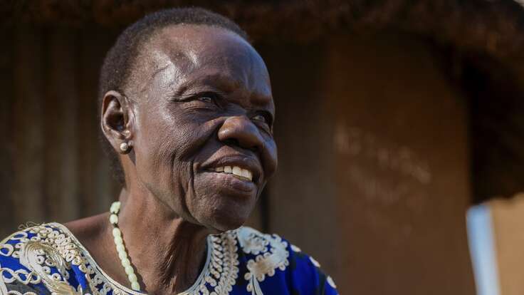 Side profile of Beatrice smiling