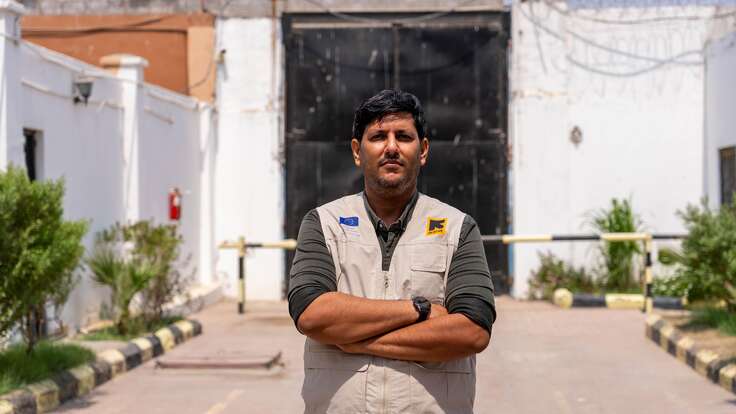 Dr Ahmed, arms crossed, looking at the camera. 