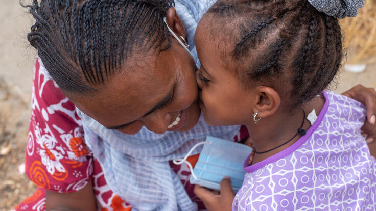 Azmera getting a kiss on the check from her daughter