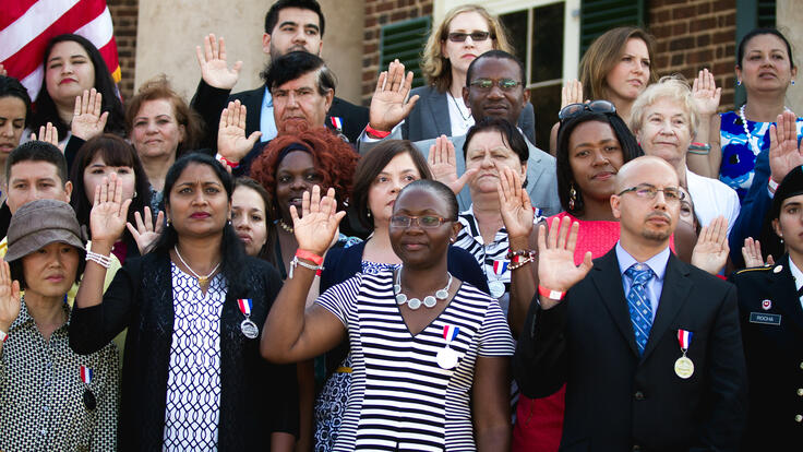 New U.S. citizens taking an oath