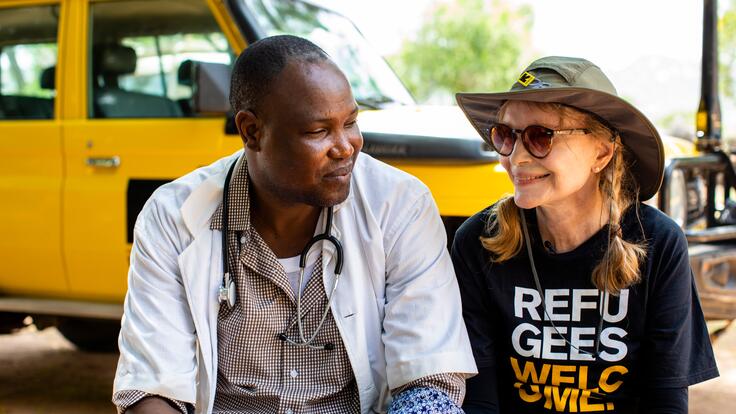 Mia Farrow sits talking with Bebnone Dominique, head of the Mangalme’ Health Center where the International Rescue Committee works in the Guera region of Chad