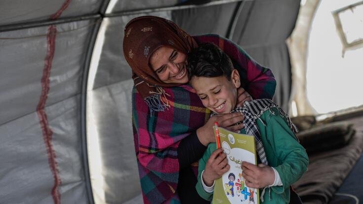 Omar and his mother, Sundus, laughing together 