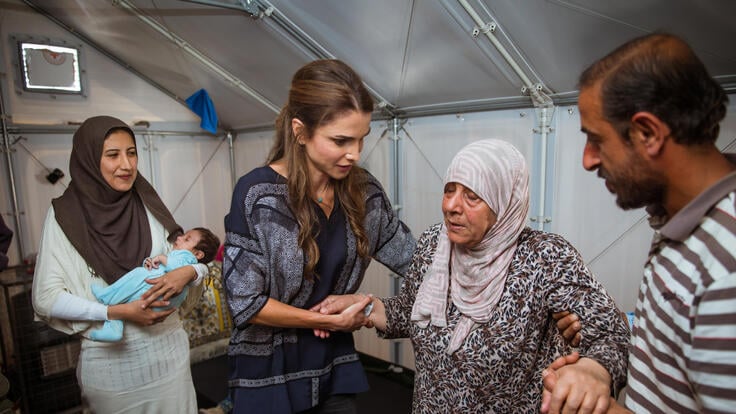 Queen Rania speaking to a group of Syrian women in Kara Tepe