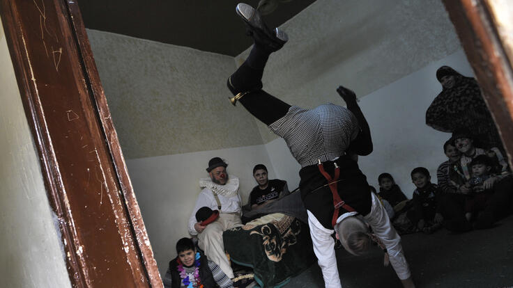 One of the Clowns Without Borders clowns doing a handstand.