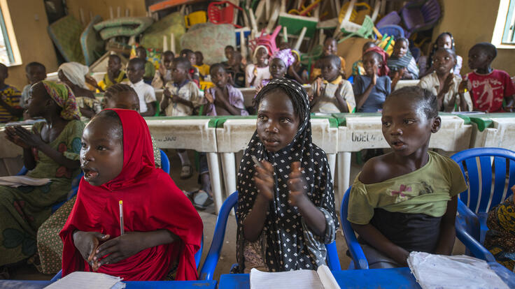 A classroom of children studying.