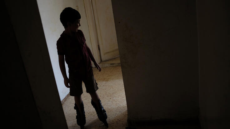 Five-year-old Mohammad roller-skating around the house.