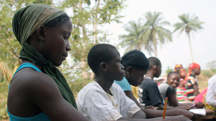 A group of children studying.