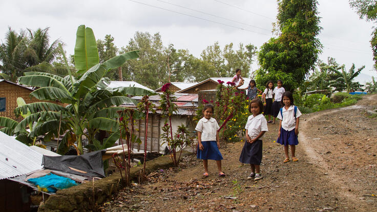 Kids playing outside in Agdaliran one year after the storm.