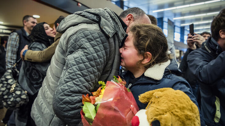 11-year-old Alaa crying aand hugging her brother-in-law.