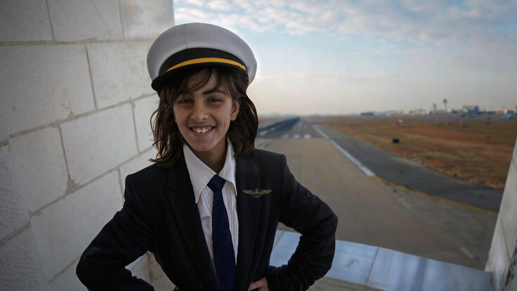 A girl wearing a sailor's costume.