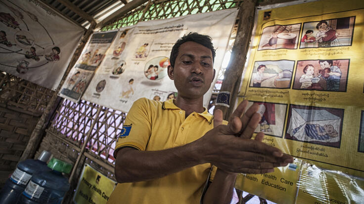 IRC community health worker providing education on practicing good hygiene.