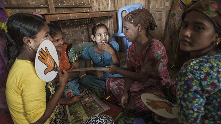 A group of women and girls during an education session.