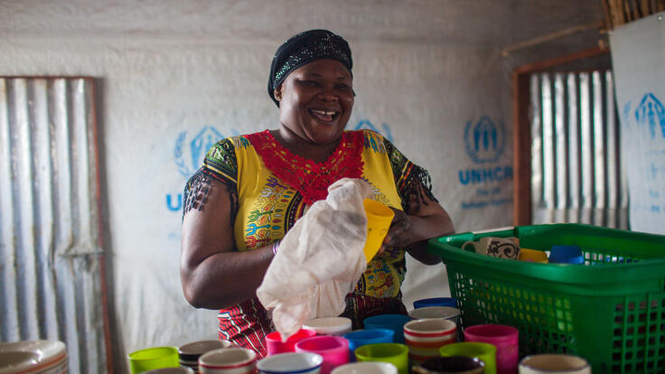 A woman bagging groceries.