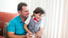 Hamzah with his son Abdullah in their home in California 