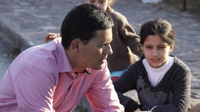 David Miliband with refugee children in Greece