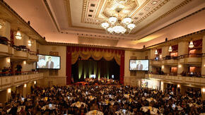 A past International Rescue Committee Rescue Dinner at the Waldorf Astoria Hotel in New York, as seen from an upper balcony. 