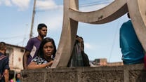 A young girl on the Simon Bolivar Bridge, Colombia. May 22, 2018.
