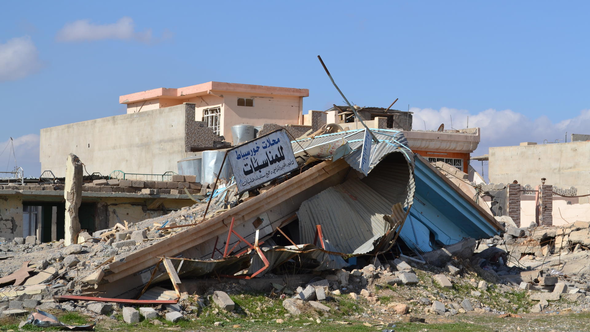 A damaged building in a Mosul neighborhood retaken from ISIS