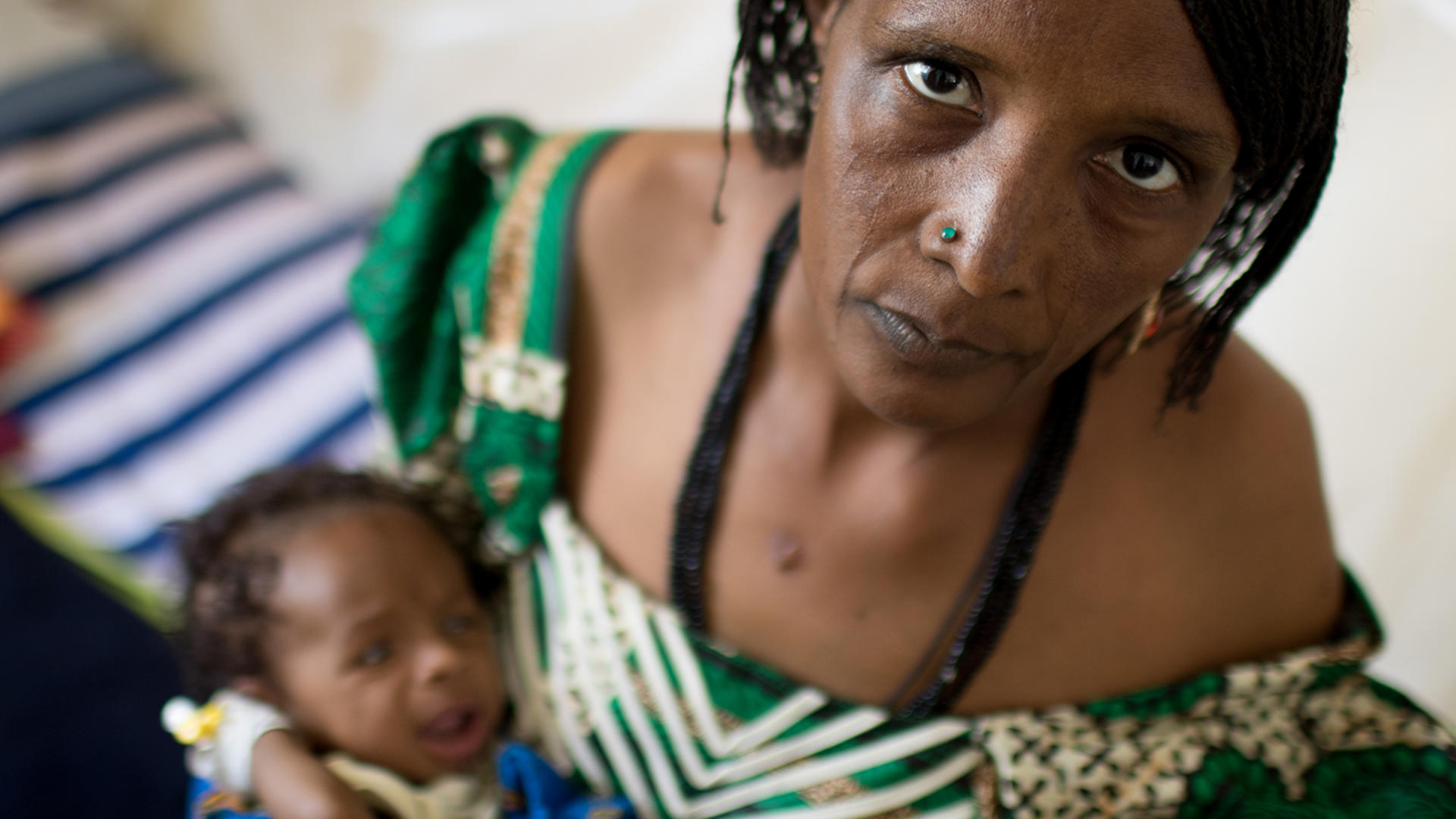 A mother and four-month-old baby at a malnutrition treatment center in Nigeria