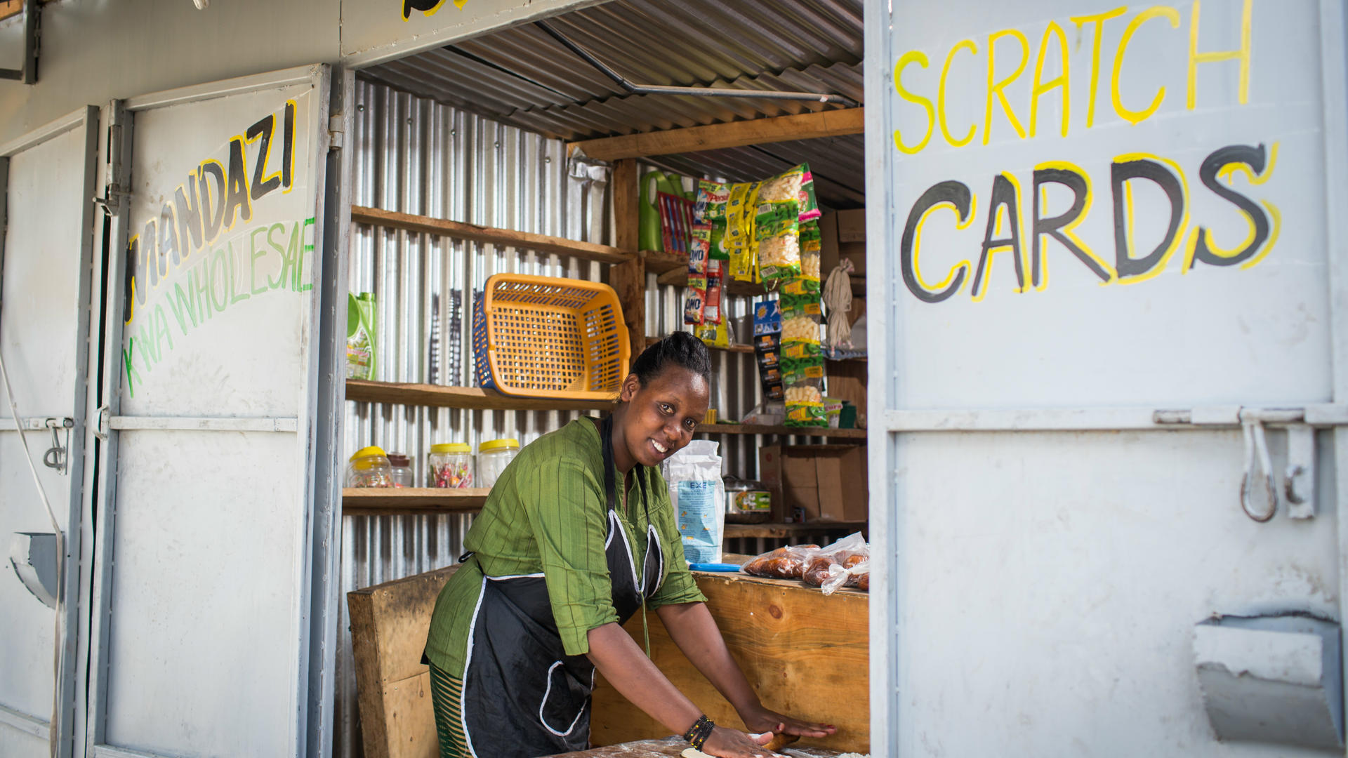 Chantal Rutonda Nyamuco makes mandazi bread at her stand in Nairobi