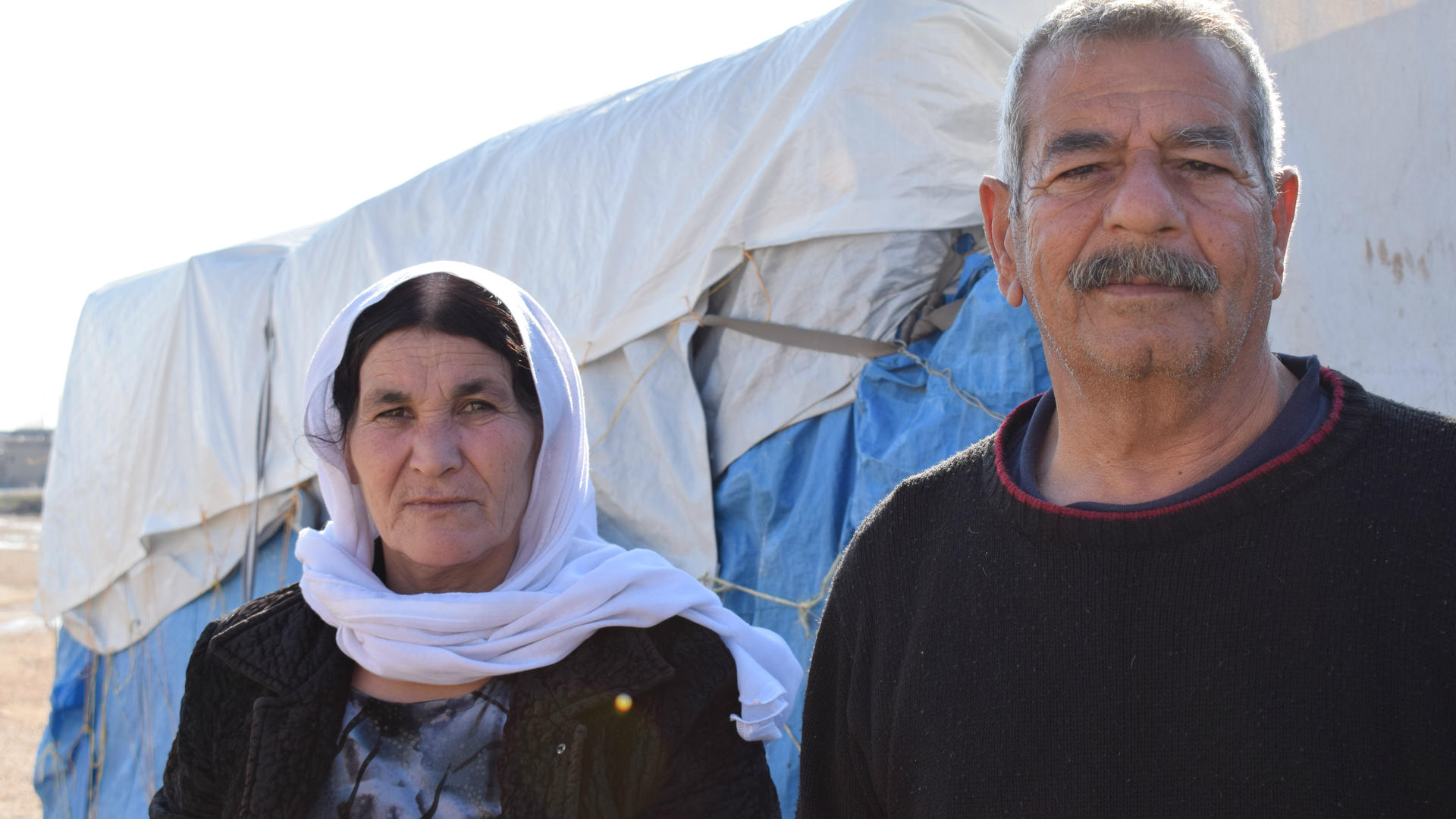 Suleiman Khalf Kajo and his wife, Khabshe in Newroz Suleiman Khalf Kajo and his wife, Khabshe outside a tent in Newroz refugee camp in Syria