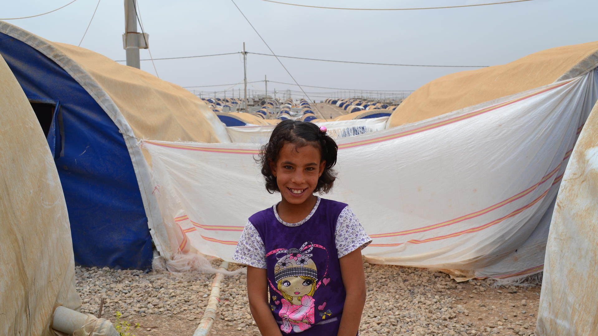 11-year-old Farah is living in Nargazilia camp 11-year-old Farah outside her family's tent in Nargazilia camp