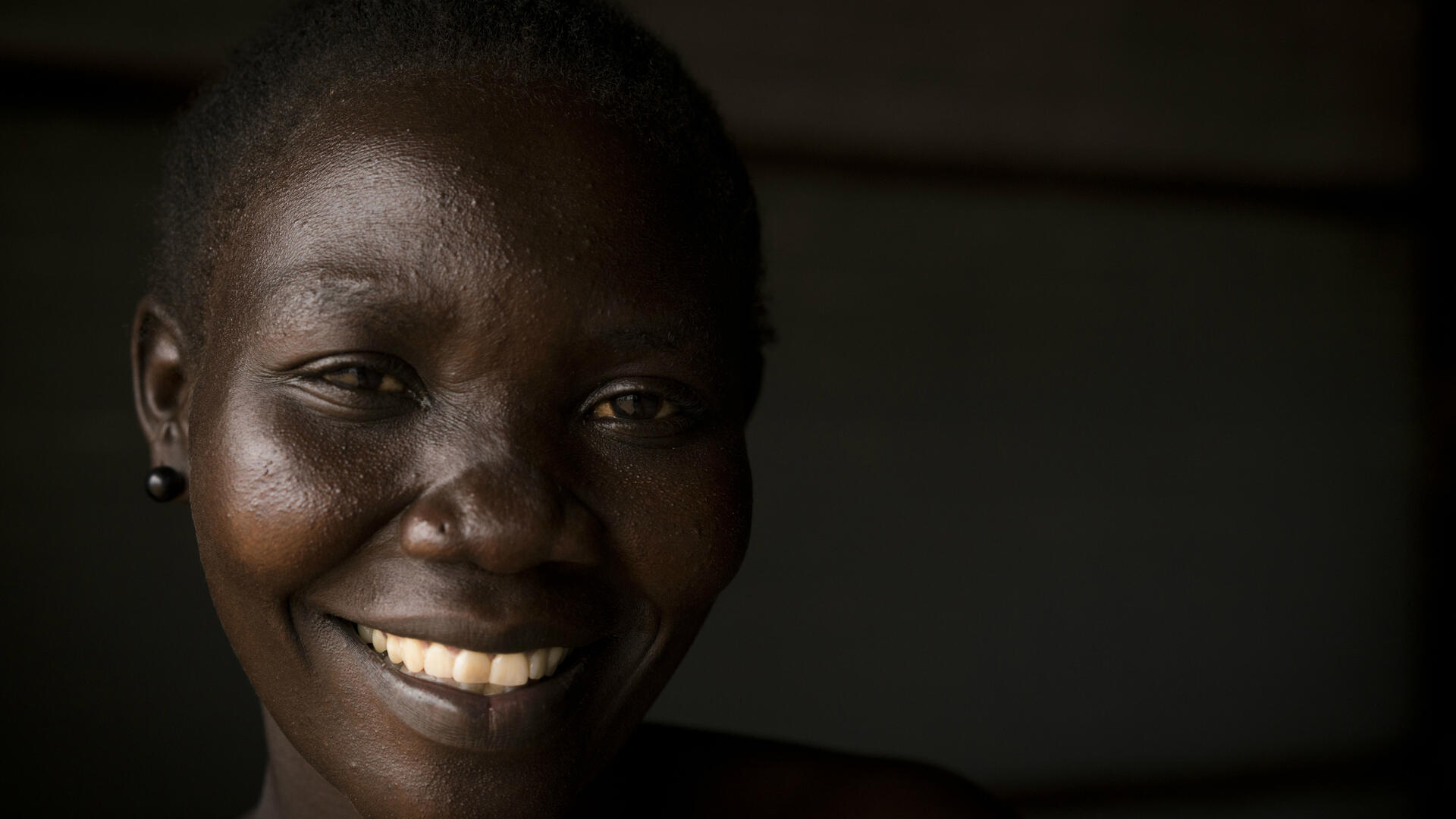 After losing her husband to the war in South Sudan, social worker Lilian Dawa fled with her two young children to Uganda, where she helps other refugee women as an IRC community volunteer. Lilian Dawa in Bidi Bidi, Uganda