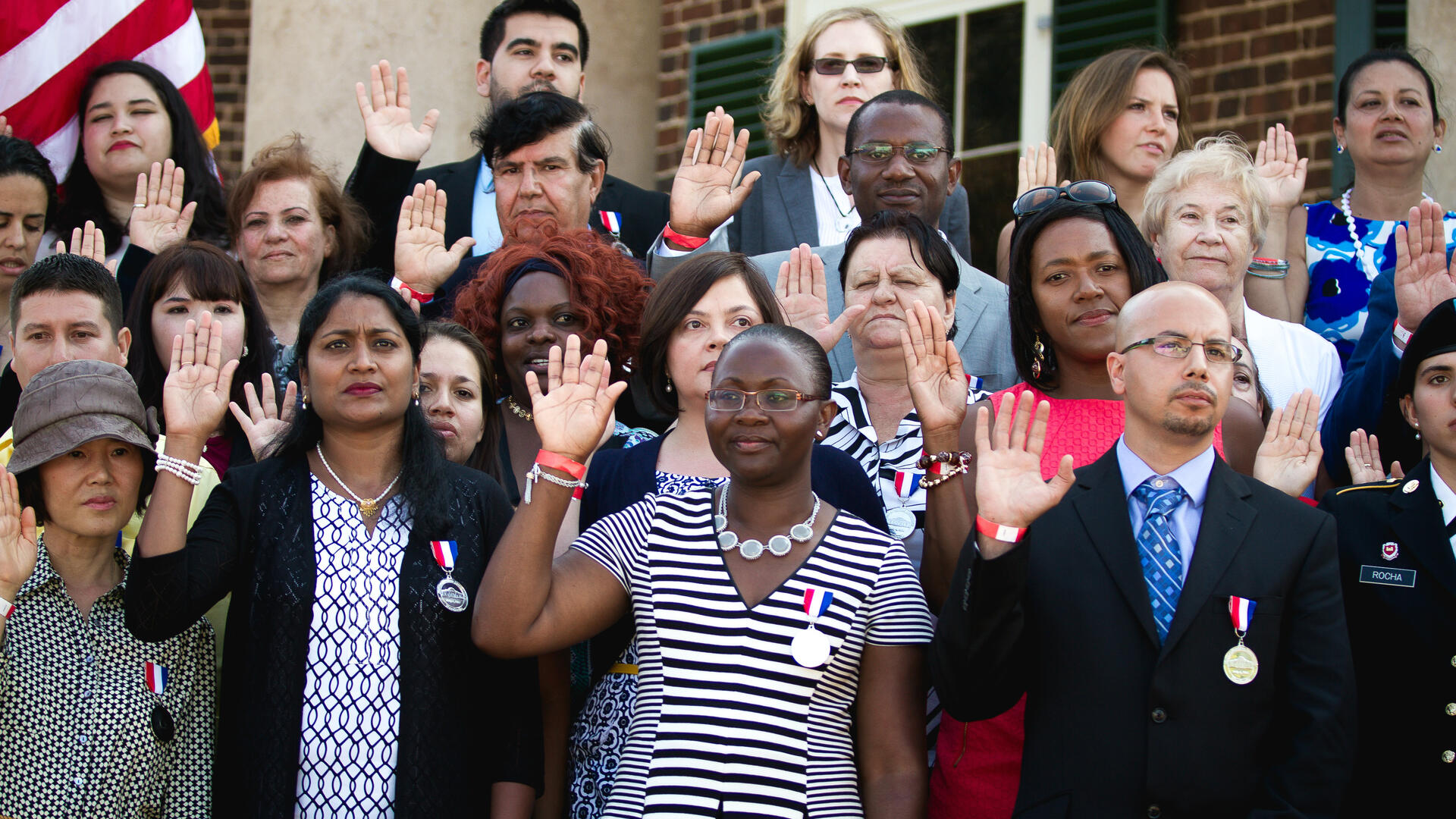 New U.S. citizens taking an oath in Charlottesvillle, VA July 4, 2014 New U.S. citizens taking an oath