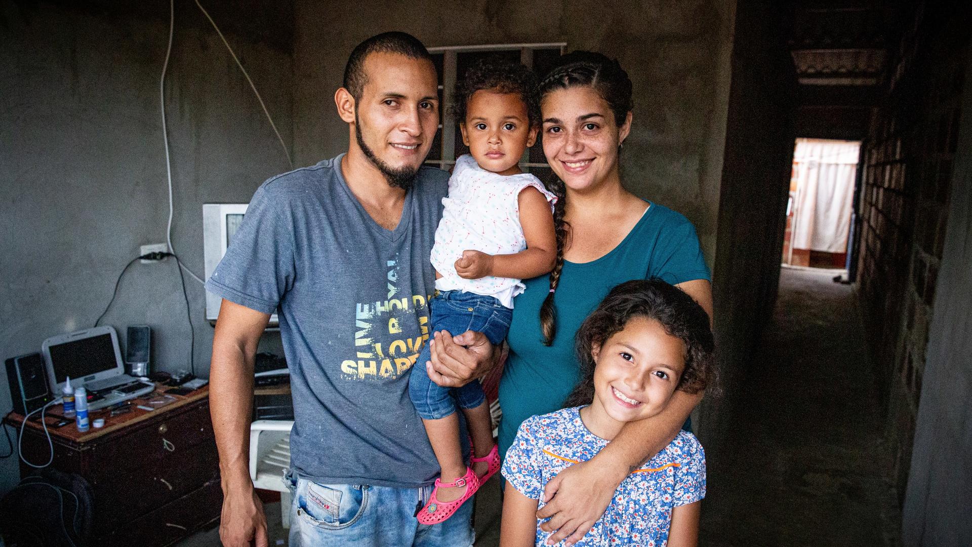 Andrea and her family Andrea Rodriguez with her husband and two daughters in their home in Venezuela.