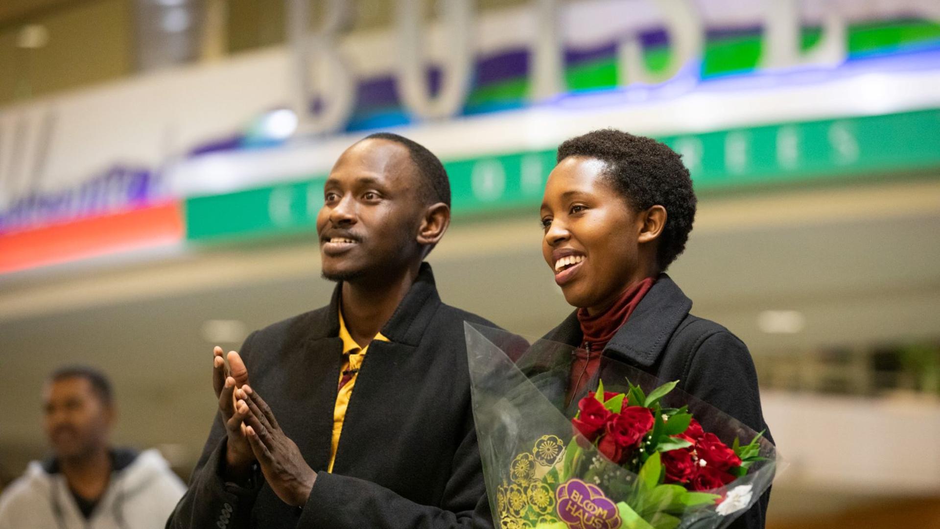 Congolese refugees Devin and Nadine await family members arriving at Boise Airport.