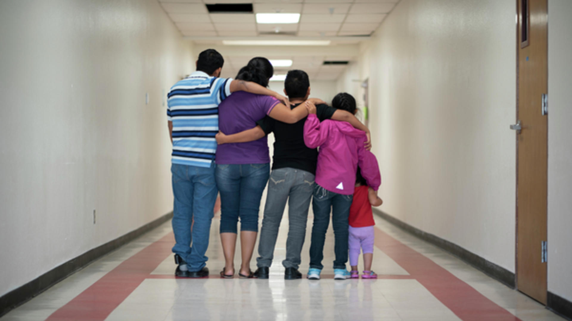 An asylum-seeking family from Central America at an International Rescue Committee welcome center shelter in Phoenix, Arizona.