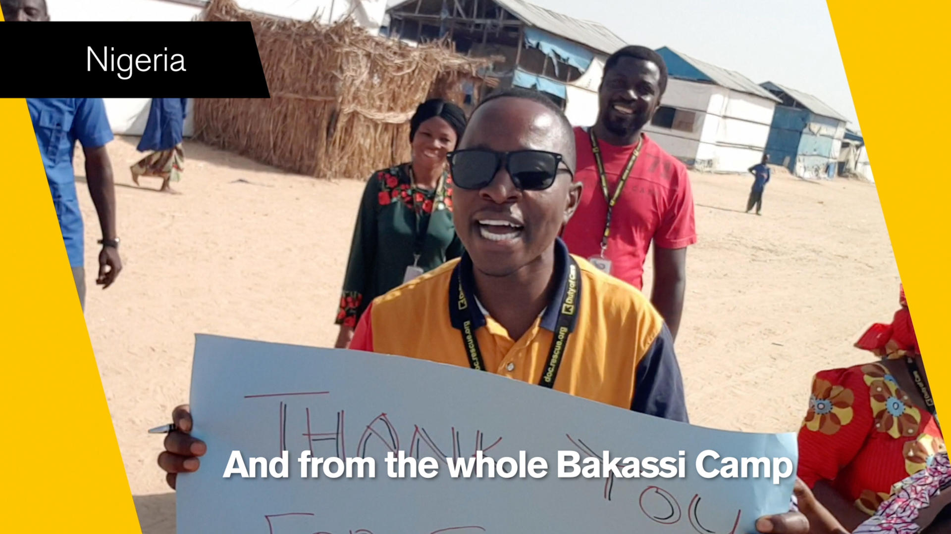 An International Rescue Commmittee aid worker holds a 'thank you' sign in a still from a video thanking IRC supporters An IRC aid worker in Nigeria holds up a 'thank you' sign in a still from video thanking IRC donors