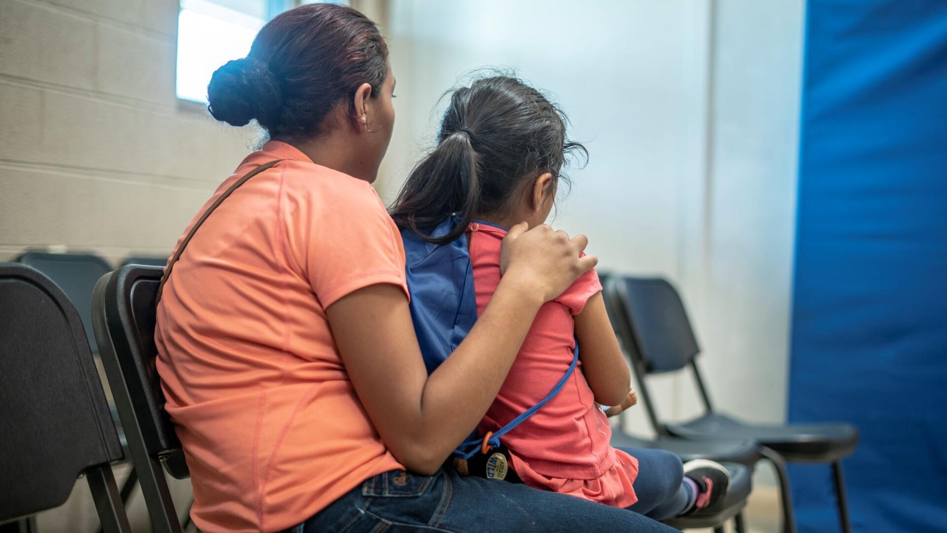 Emilia, 21, holds her 4-year-old daughter at the shelter in Phoenix where the IRC welcomed them after they were detained while fleeing to the U.S. from Honduras.