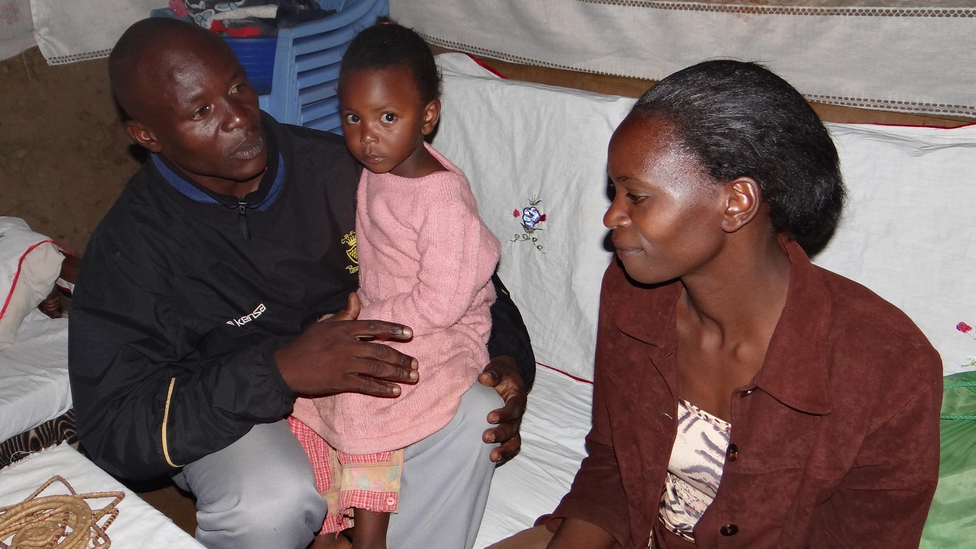 Andrew with his wife and daughter