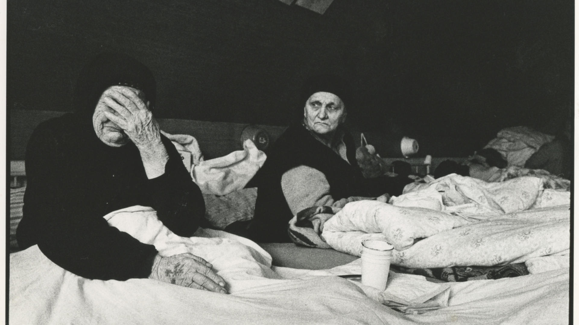 Bosnian refugees in Croatia Two Bosnian women lie in beds in a refugee camp in Croatia, one of whom is crying.