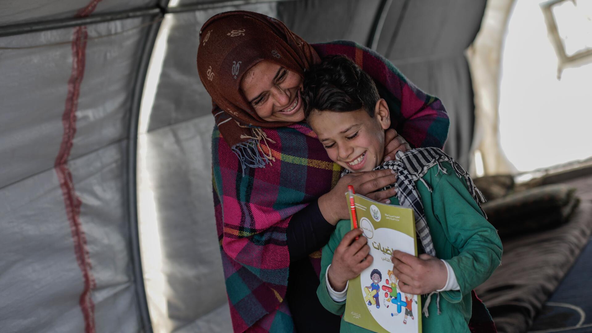 Omar and his mother, Sundus Omar and his mother, Sundus, laughing together